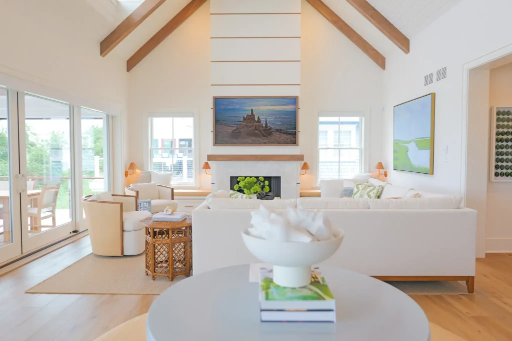 Bright, modern living room interior design with invisible in-wall speakers. Home audio and video installers