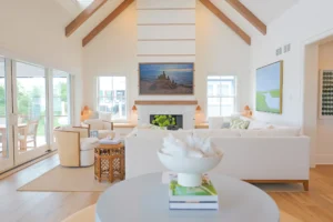 Bright, modern living room interior design with invisible in-wall speakers. Home audio and video installers