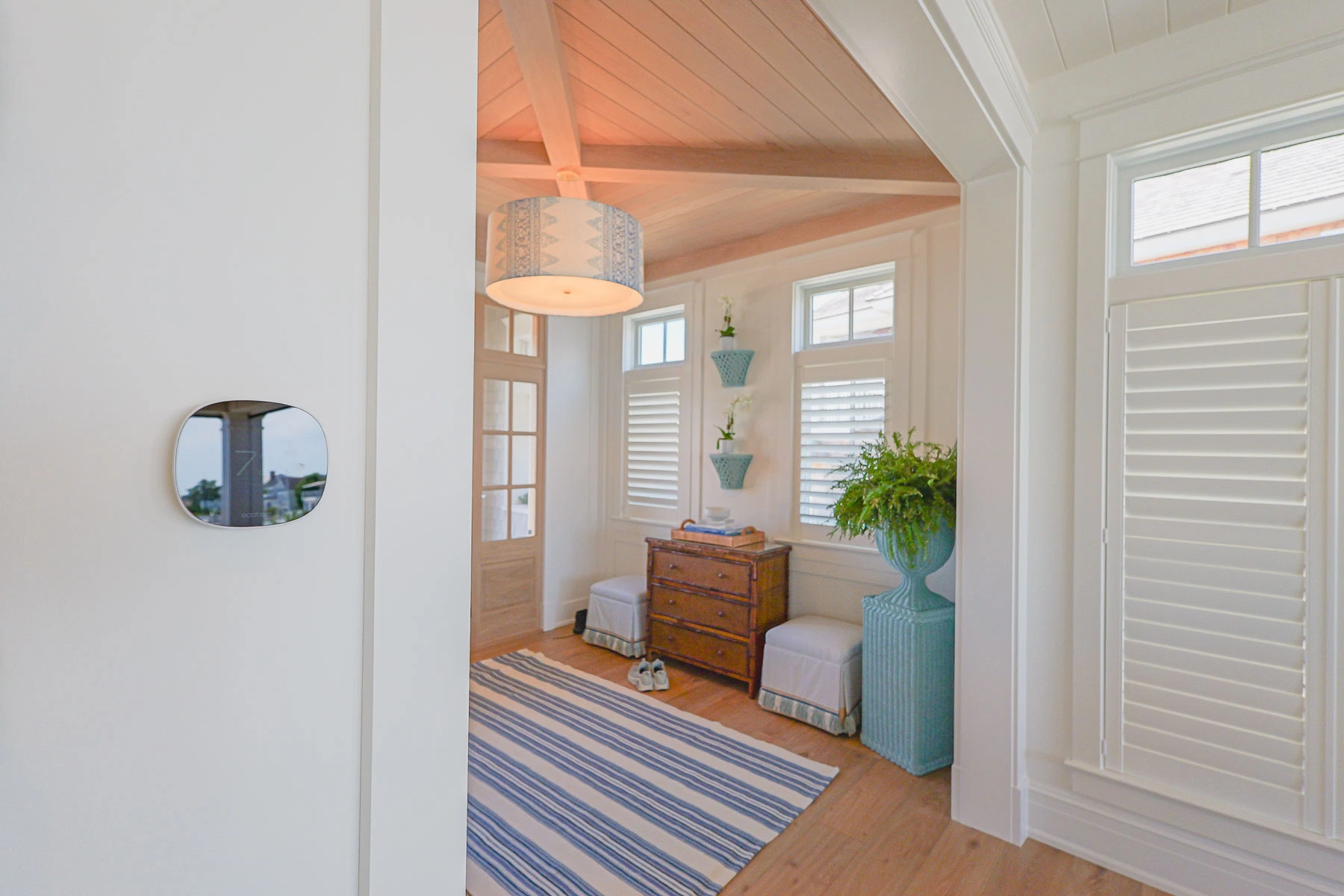 Ecobee smart thermostat installed in the foyer of a Stone Harbor, NJ home, integrated with the home's smart home system by Cooltronics.