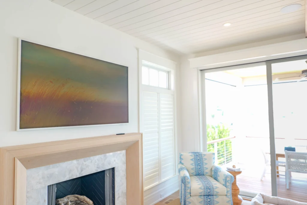 stone-harbor-samsung-frame-tv-sitting-area-lutron-shade-cooltronics Samsung Frame TV and motorized Lutron shade in a sitting area of a Stone Harbor, NJ home, installed by Cooltronics.